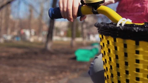 Five-year-old little blonde girl riding bike in an old park. Stock Footage 109149296