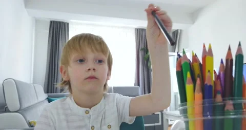 Five years old boy with tablet and drawing tools. Stock Footage 135764681