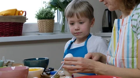 Five years old child boy kid coloring easter eggs with egg dye. Video stock 123041855