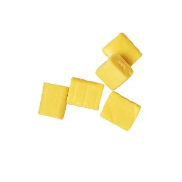 Five yellow rectangular chewy candy on a white, mamba Stock Photos
