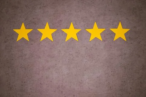 Five yellow stars on gray textured background. Stock Photos