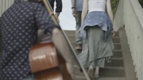 Five Young Musicians Reaching the Top of the Stairs Stock Footage 81518903