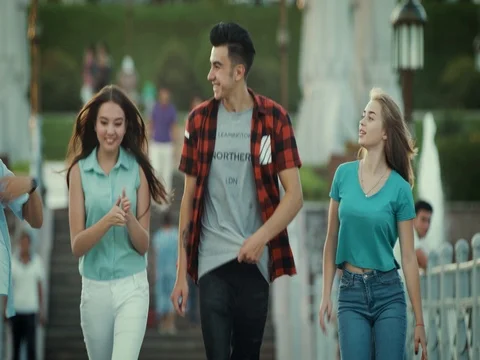 Five young people are having fun on the bridge Video stock 79589022