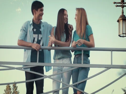Five young people have fun on the bridge Video stock 79588979