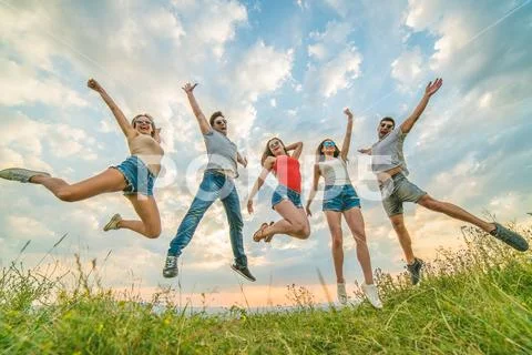 The five young people jumping Stock Photos