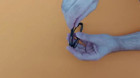 Fix Loose Glasses Screws with Ease. Simple Hack Stock Footage 305541401