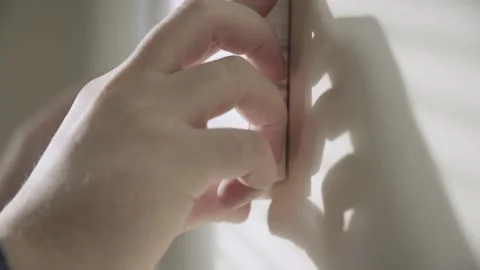 Fix the Photo Frame on the Wall. Close-up Stock Footage 149115165