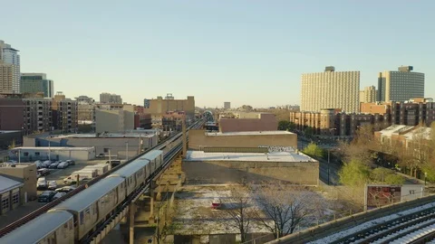 Fixed Aerial Shot as CTA Train Arrives at CTA Station [4K] Video stock 107112238