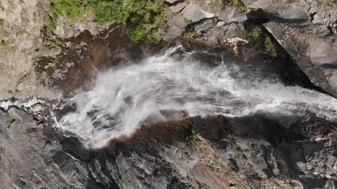 Fixed aerial top view of a big moutain waterfall Stock Footage 112613773