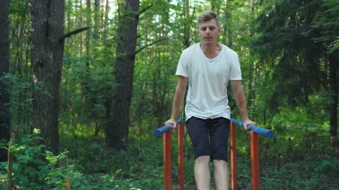 Fixed Athletic Caucasian Young Man is doing difficult exercises for the press. Stock Footage 157070754