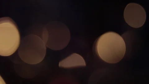 Fixed bokeh with golden color moving down and to the left 스톡 동영상 309575166