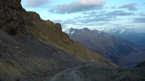 A fixed camera on the car captures the road in the mountains Stock Footage 161859088