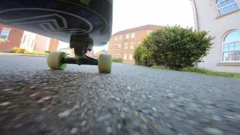 Fixed Camera Onboard Skateboard Deck Being Ridden Fast on British Sidewalk Stock Footage 239033804
