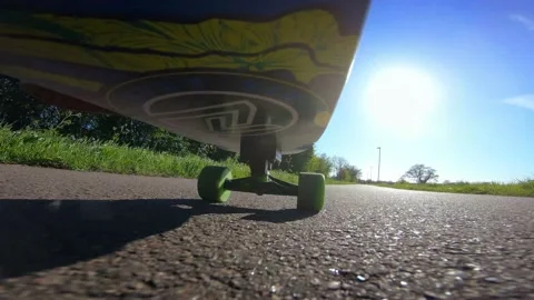 Fixed Camera Onboard Skateboard Deck Being Ridden Fast on British Sidewalk Stock Footage 239096731