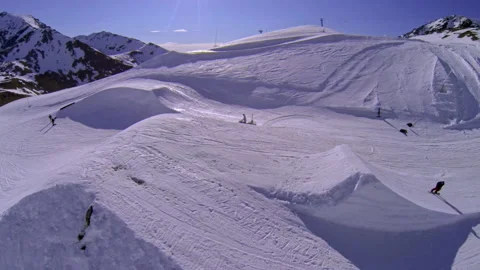 Fixed drone shot Snowboarder does a jump in New Zealand  Stock Footage 195293547
