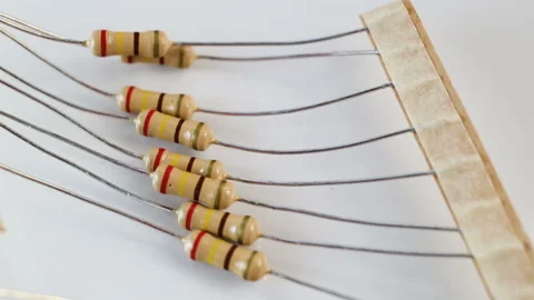 Fixed (fixed-value) permanent resistor on the table. Extreme close-up, real time Stock Footage 129770815
