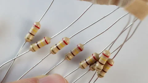 Fixed (fixed-value) permanent resistor on a white background. Extreme close-up, Stock Footage 129770863