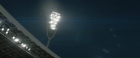 FIXED Floodlights are turning off over large soccer stadium Stock Footage 158788246