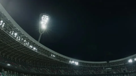 FIXED Floodlights are turning off over large soccer stadium Stock Footage 159642808