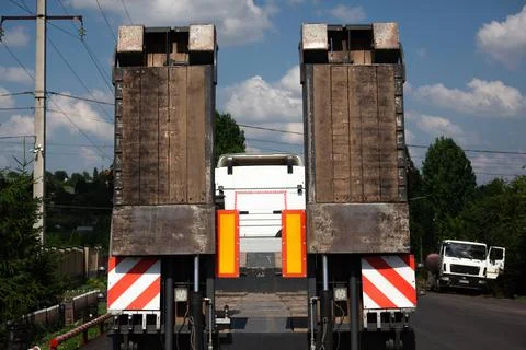 Fixed low loader trawl. Truck carries special equipment. Low loader trawl on Stock Photos