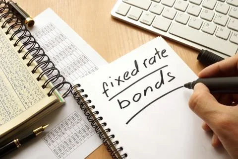 Fixed rate bonds written in a note. Trading concept. Stock Photos
