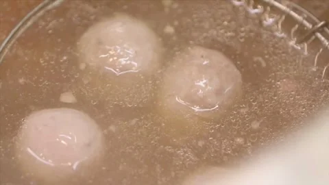 Fixed shooting of hand cooked beef balls and bone. Video stock 250235226