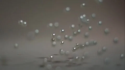 Fixed shooting of pearl falling in slow motion. Stock Footage 249047713