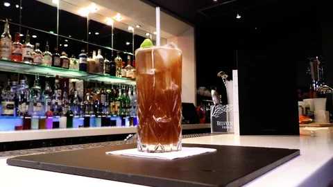 Fixed shot and focus pull of Long Island Iced Tea cocktail Stock Footage 106519356