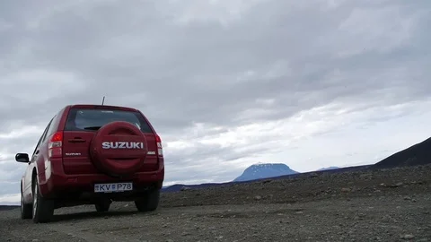 Fixed shot of a car driving in desert, in central Iceland Stock Footage 71278157