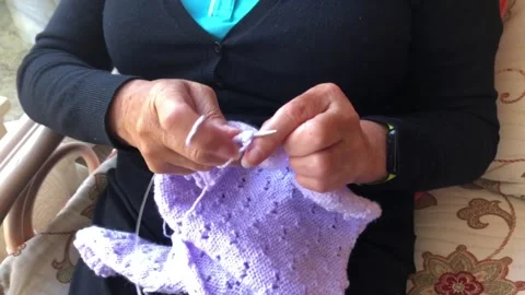 Fixed shot of a person knitting Stock Footage 133187611