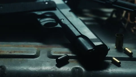 Fixed shot of a pistol, warning light red Stock Footage 337727145