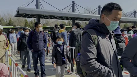 Fixed shot on a queue to visit the Great Wall of China in Beijing Stock Footage 193998112