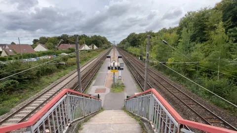 Fixed Shot of Railway Tracks and Station Staircase near Beaumont, Paris Region Video stock 318140277