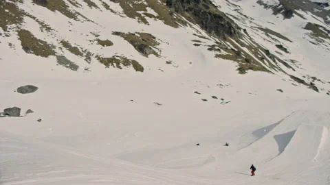 Fixed shot of Snowboarder tracking into a jump in New Zealand  Stock Footage 195292202