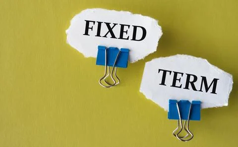 FIXED TERM - the words is printed on a white piece of paper on a yellow bac.. Stock Photos