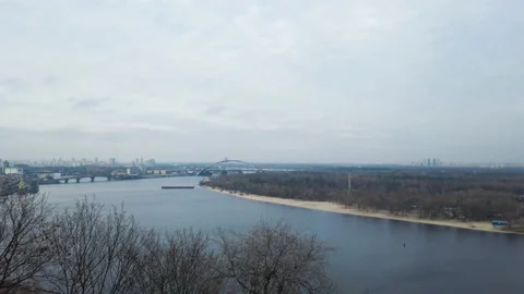 Fixed view on a wide river in the middle of the city in cold weather Stock Footage 166094759