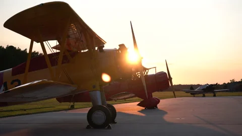 Fixed Wing Propeller Airplanes on Runway at Sunset Stock Footage 161913269