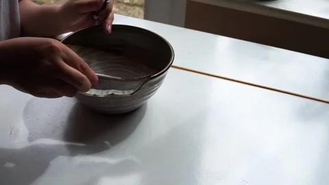 Fixing a broken bowl Stock Footage 264353347