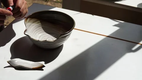 Fixing a broken bowl Stock Footage 264353949