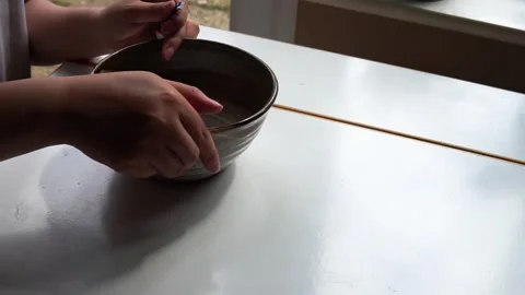 Fixing a broken bowl Stock Footage 264354008
