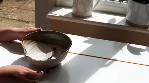 Fixing a broken bowl Stock Footage 264354079