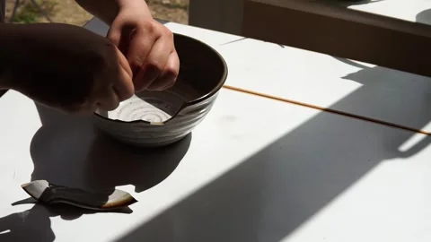 Fixing a broken bowl Stock Footage 264354606