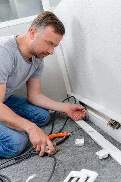 Fixing a broken electrical socket Stock Photos