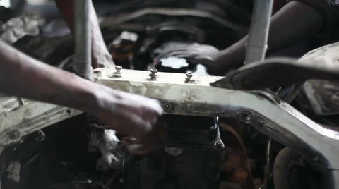 Fixing a car engine, African mechanic, Nairobi, Kenya, close up Stock Footage 52083992