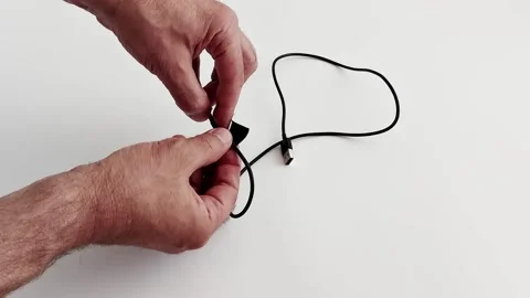 Fixing a Cracked Cable: Electrical Tape Repair Guide 스톡 동영상 310822932