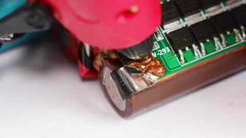 Fixing electronics with soldering tools in a workshop Stock Footage 333246954
