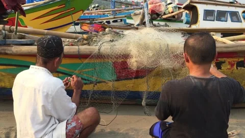 Fixing The Fish Net Stock Footage 130732709