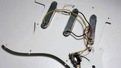 Fixing guitar pickboard and pickup Stock Footage 122102777