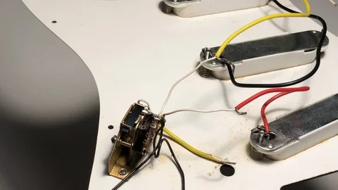 Fixing guitar pickup, cables Stock Footage 122103282