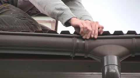Fixing gutter Stock Footage 10605780